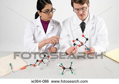 Stock Photograph - Scientists with molecule models. Fotosearch
