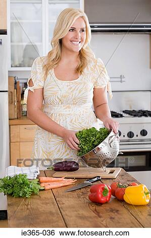 A woman preparing lettuce View Large Photo Image Stock Photograph - A woman preparing lettuce. Fotosearch