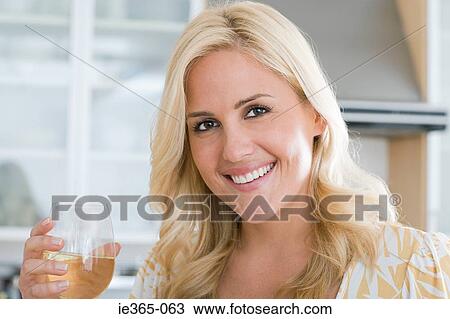 Portrait of a woman in a kitchen View Large Photo Image Stock Image - Portrait of a woman in a kitchen. Fotosearch