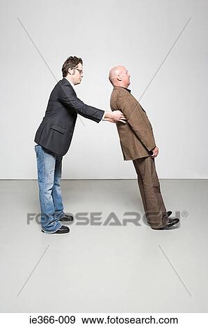 Man catching man View Large Photo Image Stock Photo - Man catching man. Fotosearch
