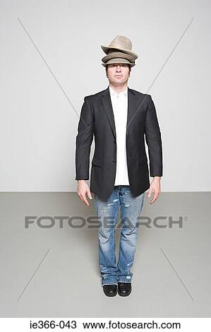 Man wearing three hats View Large Photo Image Stock Image - Man wearing three hats. Fotosearch