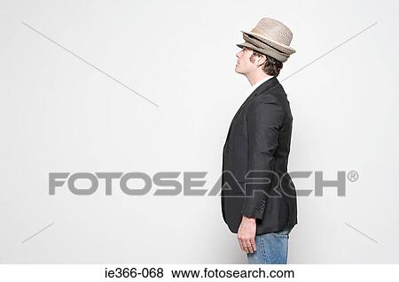 Man wearing three hats View Large Photo Image Stock Photo - Man wearing three hats. Fotosearch