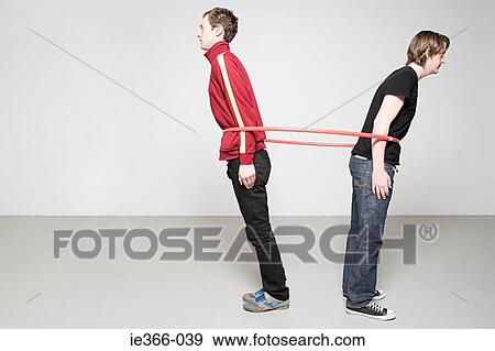 Men pulling plastic hoop View Large Photo Image Stock Photo - Men pulling plastic hoop. Fotosearch