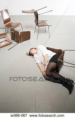 Woman and chairs on floor View Large Photo Image Stock Photo - Woman and chairs on floor. Fotosearch