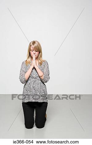 Picture - Woman praying. Fotosearch