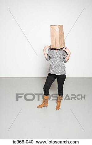 Woman with paper bag on her head View Large Photo Image Stock Image - Woman with paper bag on her head. Fotosearch