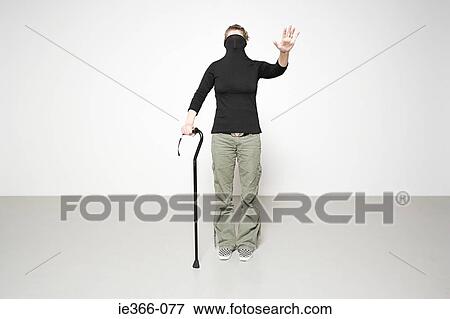 Woman with walking stick View Large Photo Image Stock Photo - Woman with walking stick. Fotosearch