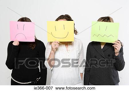 Stock Photo - Women with drawn faces. Fotosearch