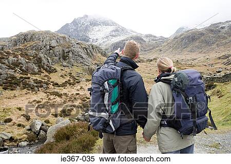 A couple hiking View Large Photo Image Stock Photography - A couple hiking. Fotosearch