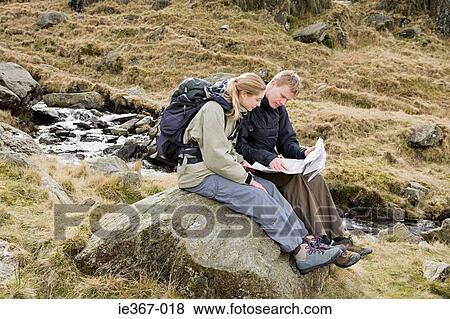 Stock Photo - A couple looking at a map . Fotosearch