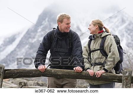 A couple on a bridge View Large Photo Image Stock Image - A couple on a bridge. Fotosearch