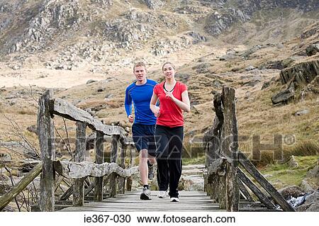 A couple running View Large Photo Image Stock Image - A couple running. Fotosearch