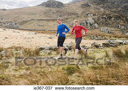 A couple running View Large Photo Image Stock Photo - A couple running. Fotosearch
