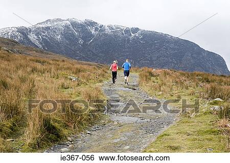 Stock Photograph - A couple running. Fotosearch