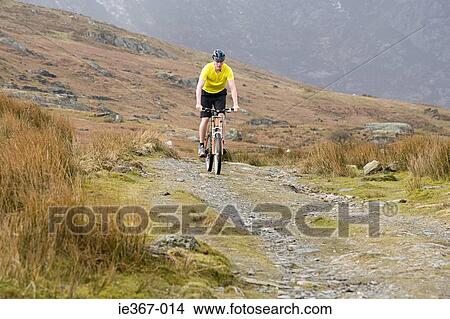 A man cycling View Large Photo Image Picture - A man cycling. Fotosearch