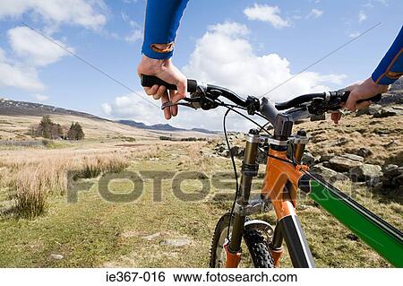 Stock Photograph - A man cycling. Fotosearch