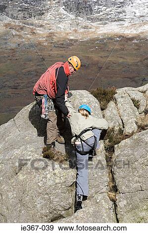 A man giving a man a helping hand View Large Photo Image Stock Photo - A man giving a man a helping hand. Fotosearch