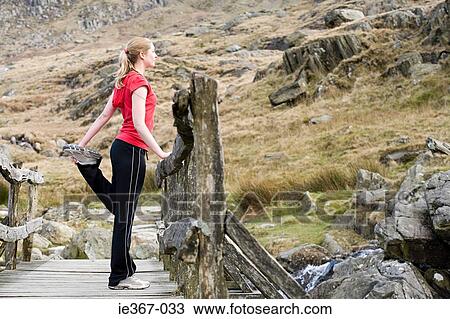 Stock Image - A runner warming up. Fotosearch