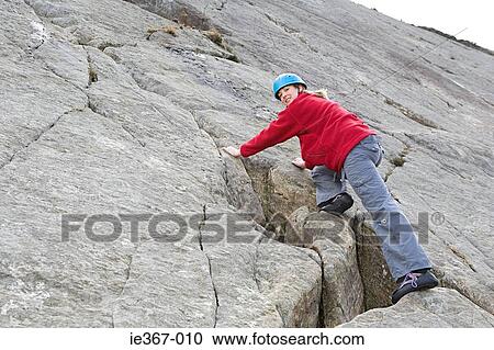 A woman rock climbing View Large Photo Image Stock Image - A woman rock climbing. Fotosearch