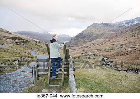 Portrait of a young woman on a stile View Large Photo Image Picture - Portrait of a young woman on a stile. Fotosearch
