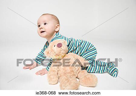 A baby boy and a teddy View Large Photo Image Stock Photo - A baby boy and a teddy. Fotosearch