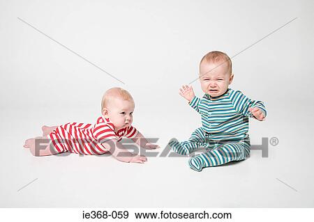 A baby boy and girl View Large Photo Image Stock Photo - A baby boy and girl. Fotosearch