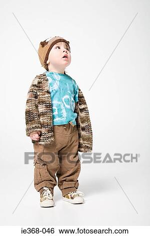A boy looking up View Large Photo Image Stock Photograph - A boy looking up. Fotosearch
