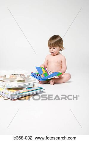 A boy reading books View Large Photo Image Stock Image - A boy reading books. Fotosearch
