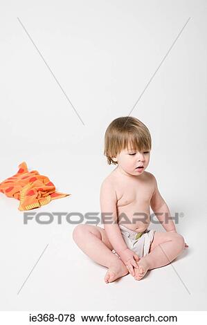 A boy wearing a diaper View Large Photo Image Stock Photo - A boy wearing a diaper. Fotosearch
