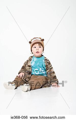 Stock Photograph - Boy wearing a hat. Fotosearch