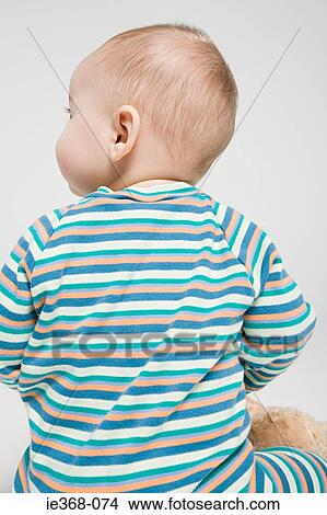 Rear view of a baby boy View Large Photo Image Picture - Rear view of a baby boy. Fotosearch