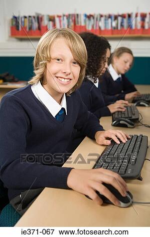 Boy at computer View Large Photo Image Stock Photo - Boy at computer. Fotosearch