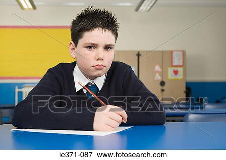 Boy in classroom View Large Photo Image Stock Photo - Boy in classroom. Fotosearch