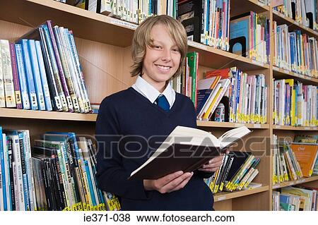 Boy in library View Large Photo Image Stock Photo - Boy in library. Fotosearch