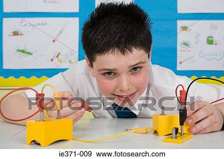 Boy in science lesson View Large Photo Image Stock Photo - Boy in science lesson. Fotosearch