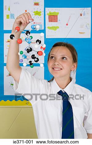 Girl holding molecule model View Large Photo Image Stock Image - Girl holding molecule model. Fotosearch