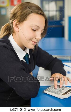Girl using calculator View Large Photo Image Stock Image - Girl using calculator. Fotosearch