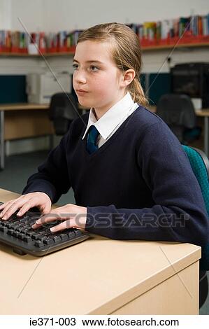 Girl using computer View Large Photo Image Stock Image - Girl using computer. Fotosearch