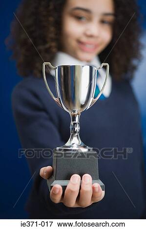 Girl with a trophy View Large Photo Image Stock Photo - Girl with a trophy. Fotosearch
