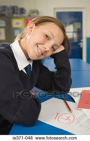 Girl with essay View Large Photo Image Stock Photo - Girl with essay. Fotosearch
