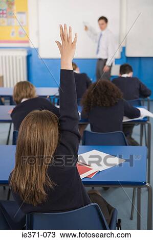 Girl with hand raised View Large Photo Image Stock Image - Girl with hand raised. Fotosearch