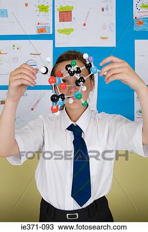 Stock Image - Girl with molecule model. Fotosearch