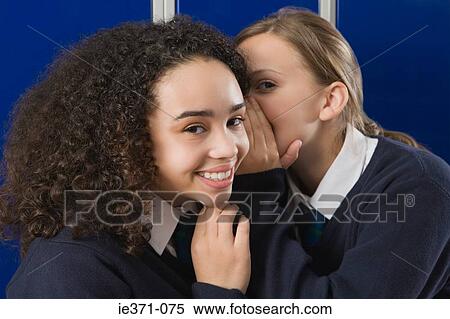 Girls whispering View Large Photo Image Stock Photography - Girls whispering. Fotosearch