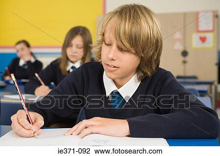 Stock Image - School students writing. Fotosearch