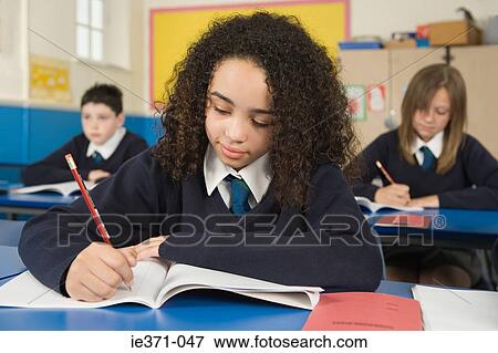 Students working in classroom View Large Photo Image Stock Photo - Students working in classroom. Fotosearch