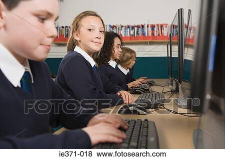Stock Photo - Students working on computers. Fotosearch