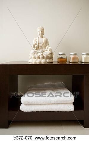 Stock Image - Buddha statue in a bathroom. Fotosearch
