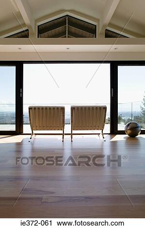 Chairs by patio doors View Large Photo Image Stock Image - Chairs by patio doors. Fotosearch