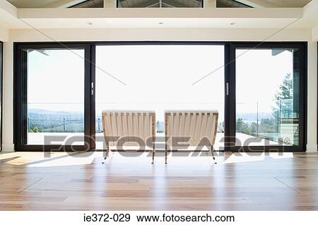 Chairs by patio doors View Large Photo Image Stock Photo - Chairs by patio doors. Fotosearch