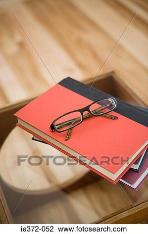 Eyeglasses on books View Large Photo Image Stock Image - Eyeglasses on books. Fotosearch